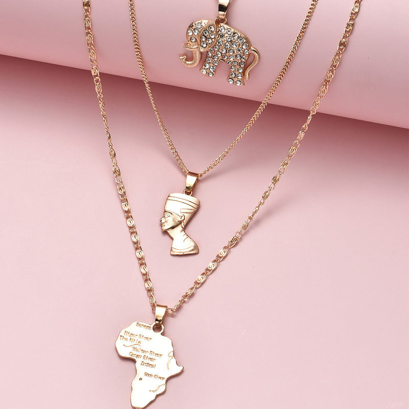 Multi-Layered Gold-Plated Necklace; Elephant, African Royalty, and Africa Map Pendant