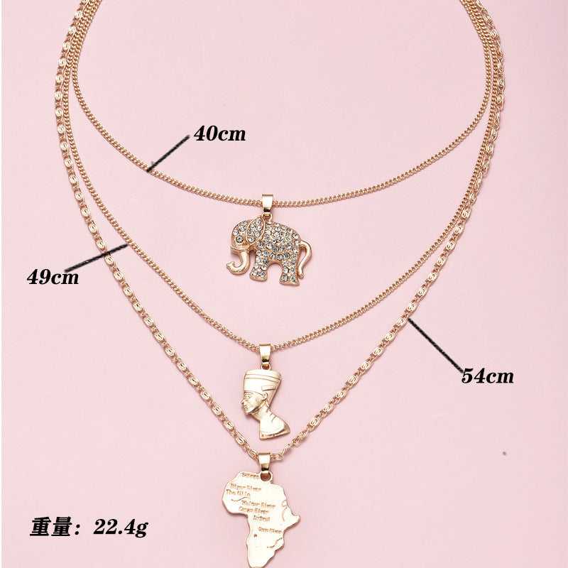 Multi-Layered Gold-Plated Necklace; Elephant, African Royalty, and Africa Map Pendant