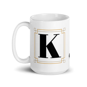 White Framed "K" Monogram Mug by Africa Creates Art